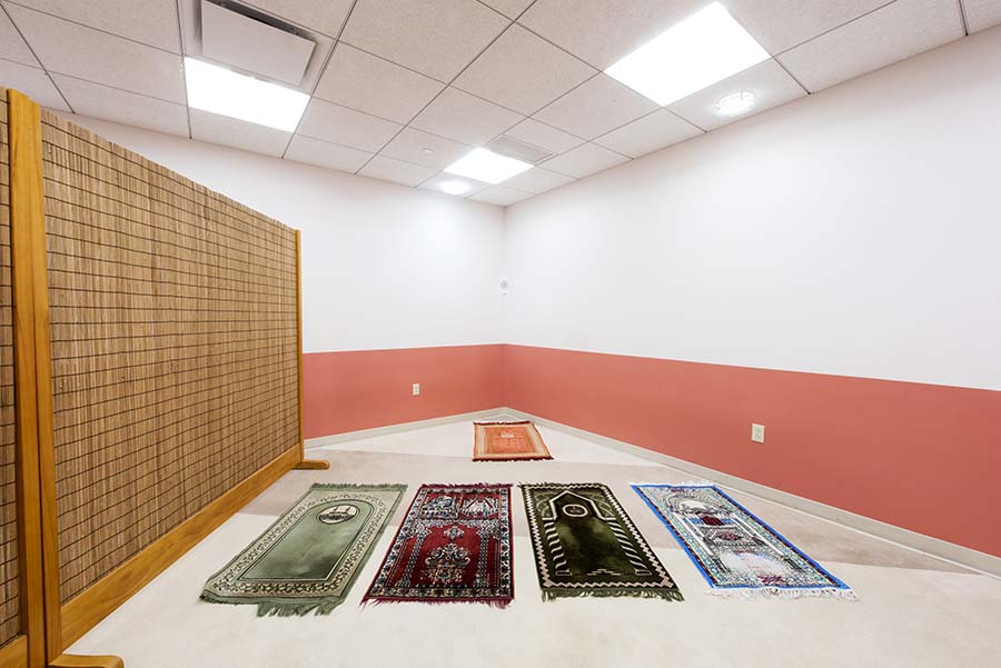 Photo of Prayer Room showing different seating mats